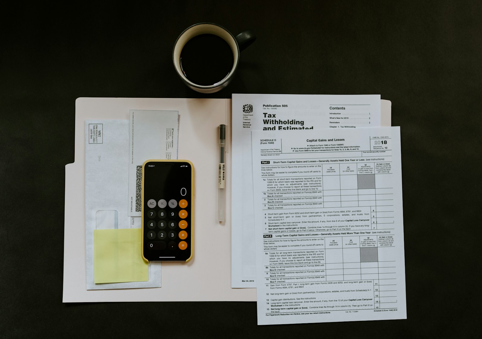 Income tax refund forms and paperwork on a desk while planning to protect a tax refund in Chapter 7 bankruptcy