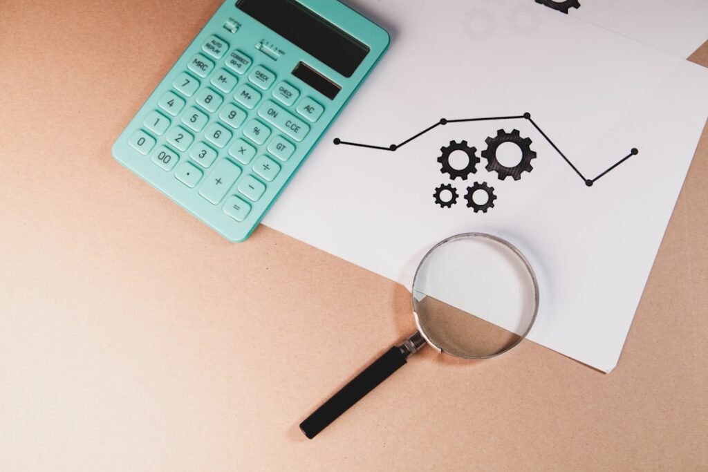Magnifying glass over financial documents representing the bankruptcy trustee reviewing transactions during the look-back period