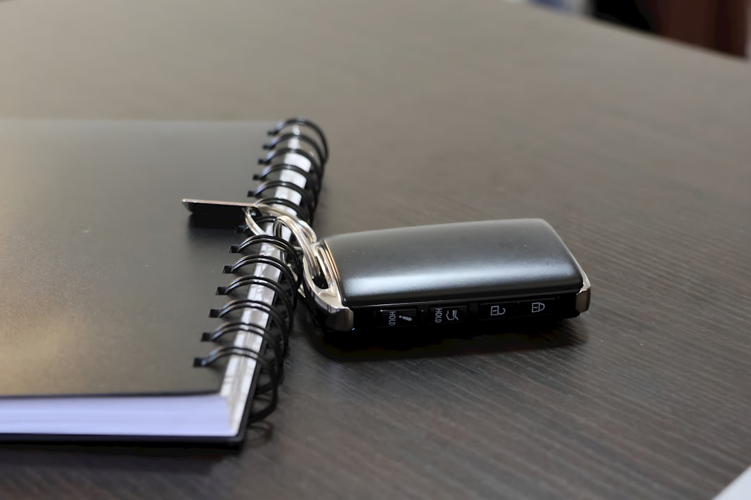 Car keys and loan paperwork on a desk representing a Chapter 13 cram down on a vehicle loan