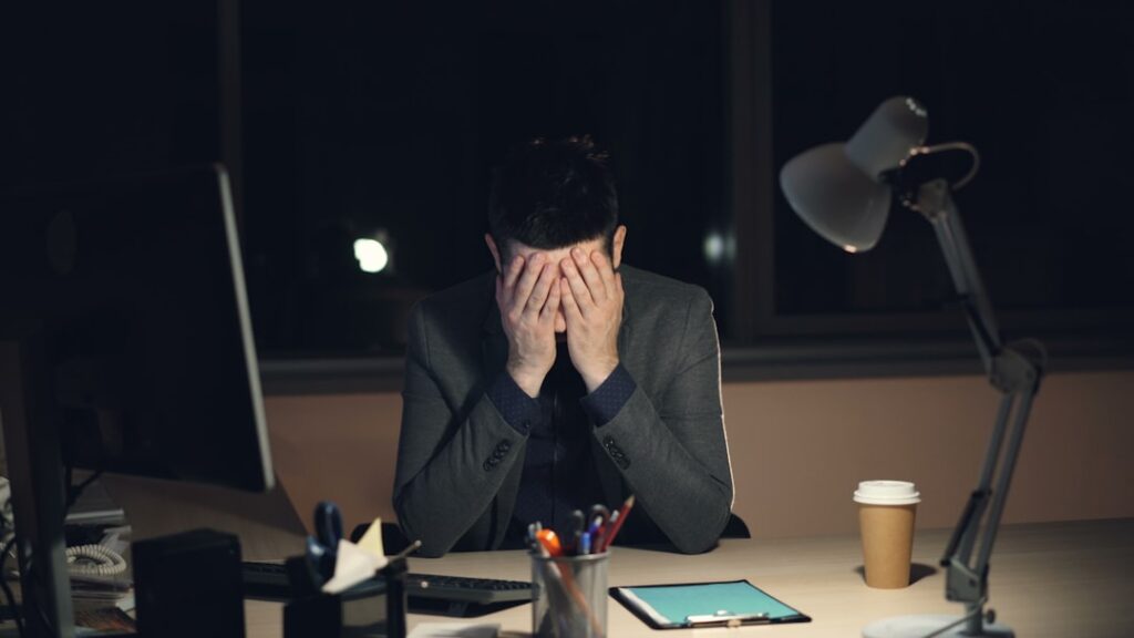 Person at a desk reviewing a Chapter 13 bankruptcy dismissal notice