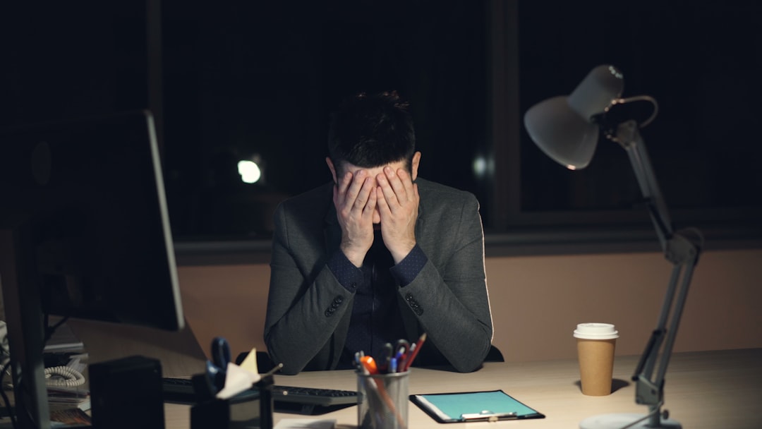 Person at a desk reviewing a Chapter 13 bankruptcy dismissal notice