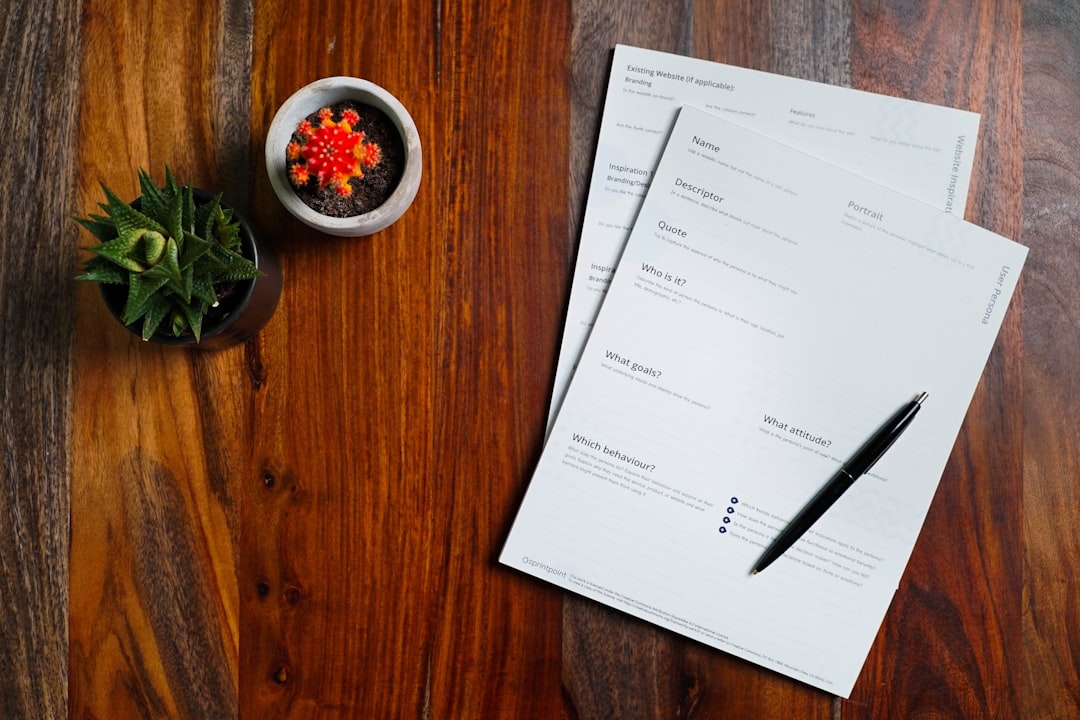 Stack of bills and financial paperwork on a desk representing priority debts
